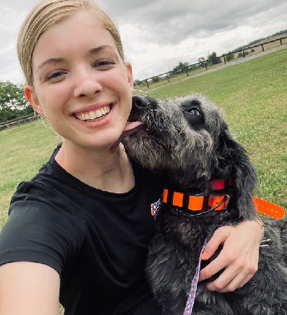 Dog training Pearisburg VA with woman and black dog outdoors